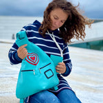 blue leather backpack with a woman on the oper on Oslo 