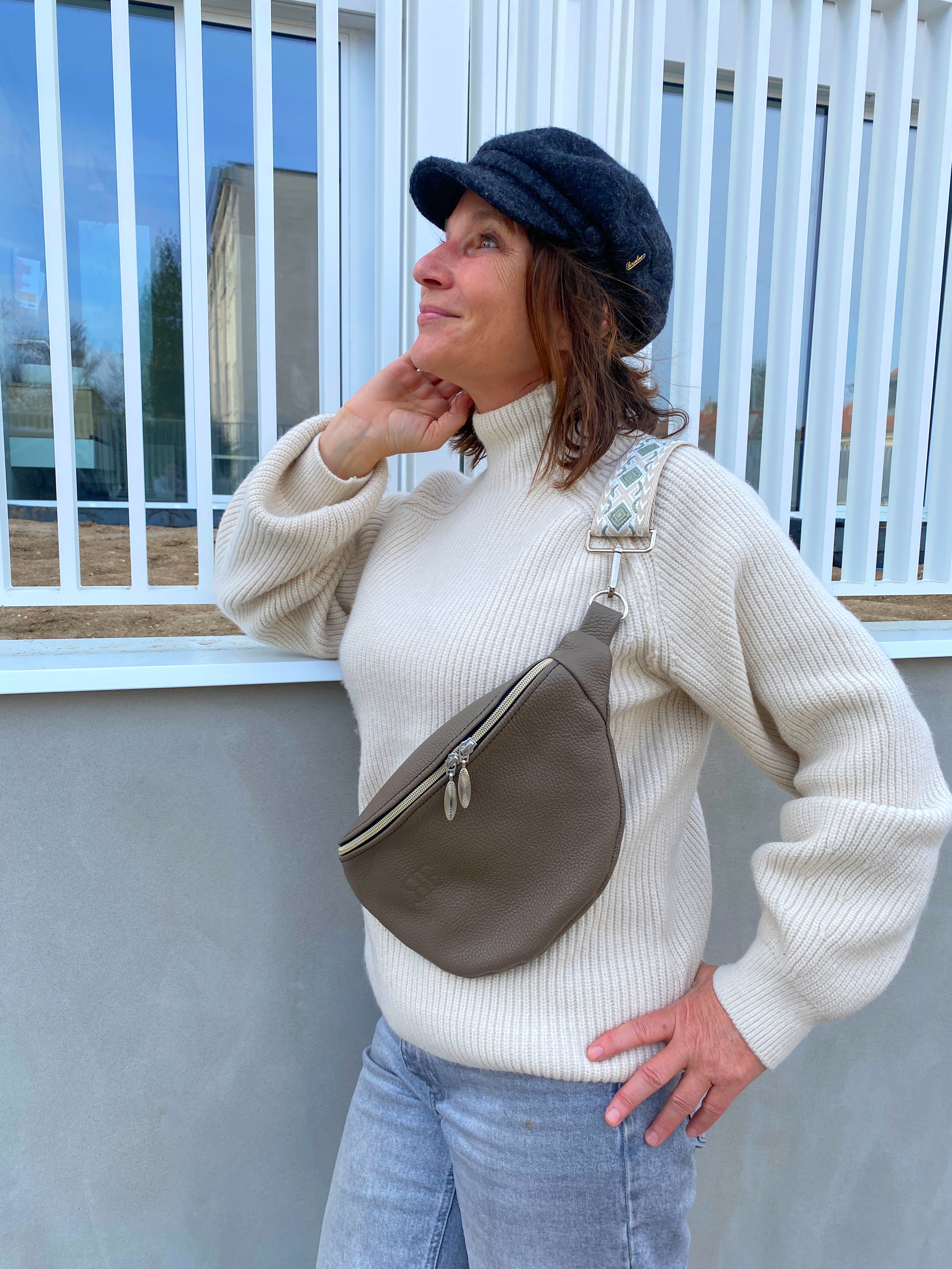 woman with leather bum bag in the taupe color