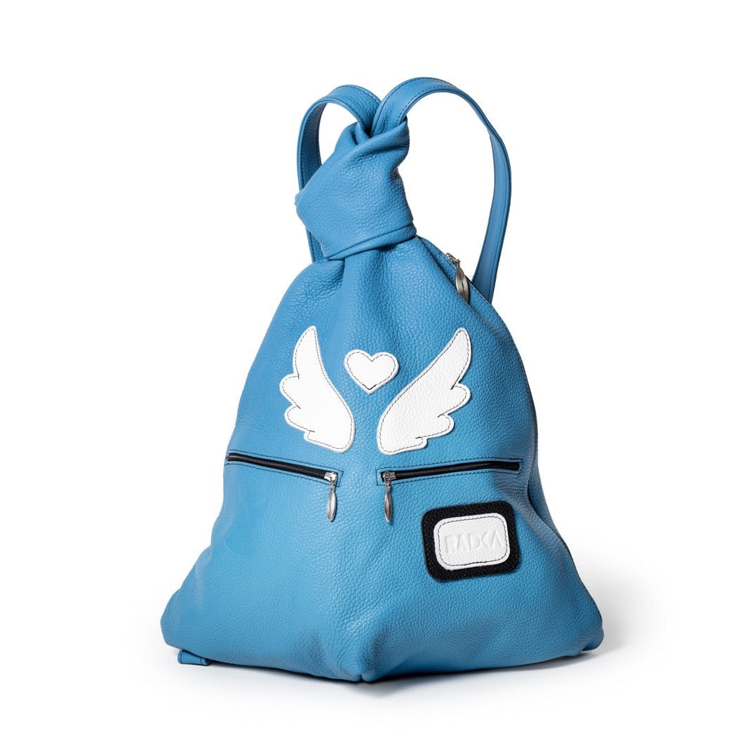 blue bag with white wings and hearth charismatic archangel backpack